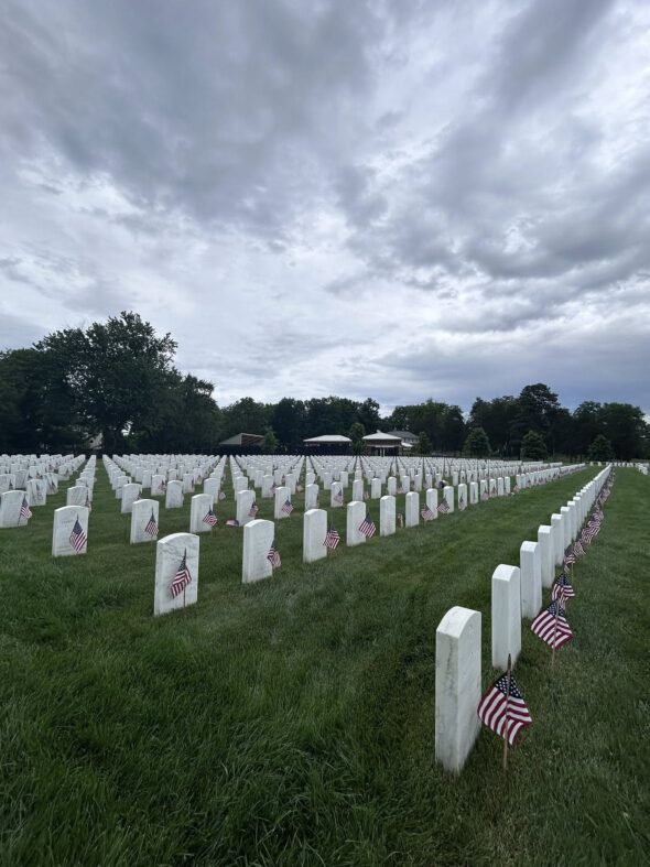 Volunteers place flags at Mountain Home National Cemetery for Memorial Day